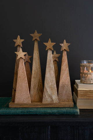 Seven Wooden Christmas Trees on a Base